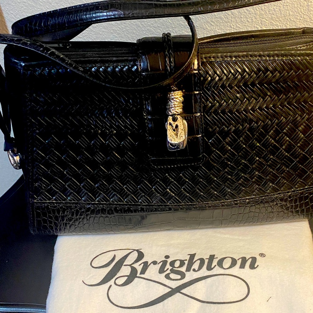 Brighton black leather shoulder bag with dust cover.